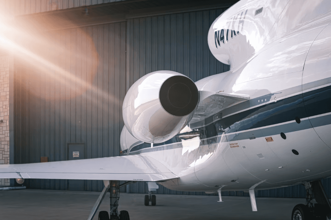 Private corporate jet parked on airport tarmac
